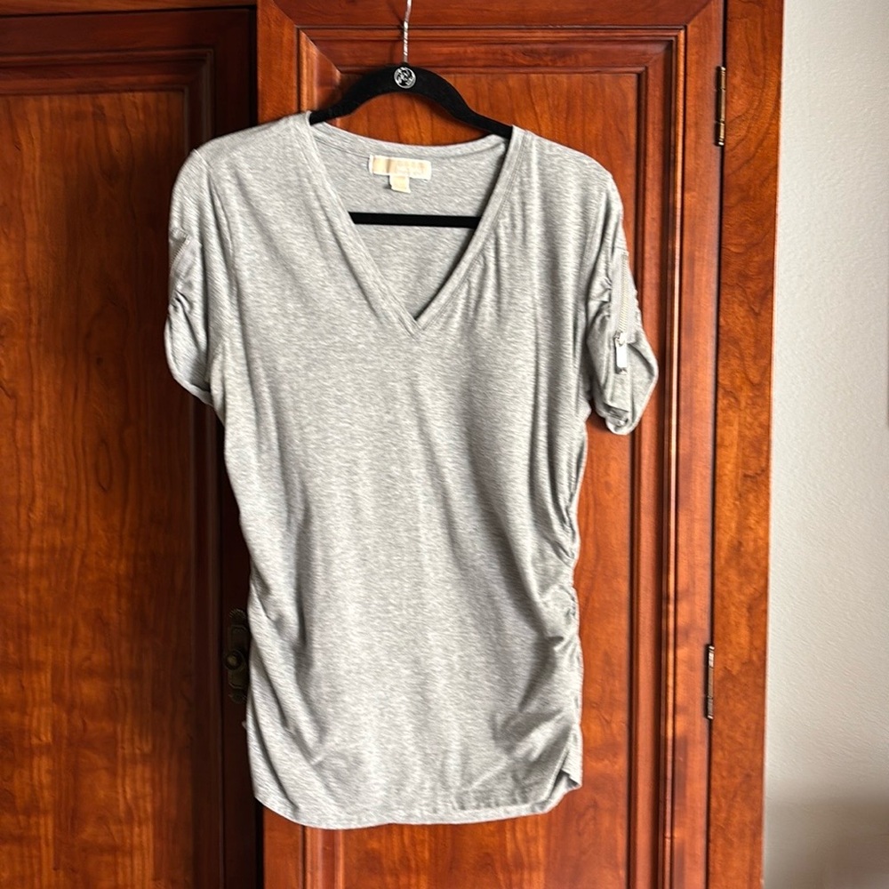 Cute Michael Kors T-shirt.  Grey color, ruched sides and zipper sleeves.